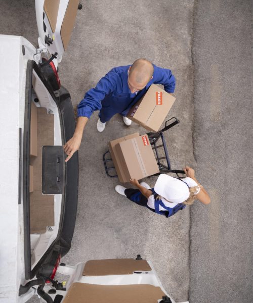 full-shot-delivery-people-holding-box